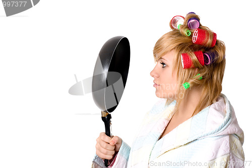 Image of housewife with curlers and pan