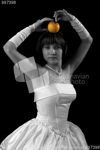 Image of Bride posing with apple