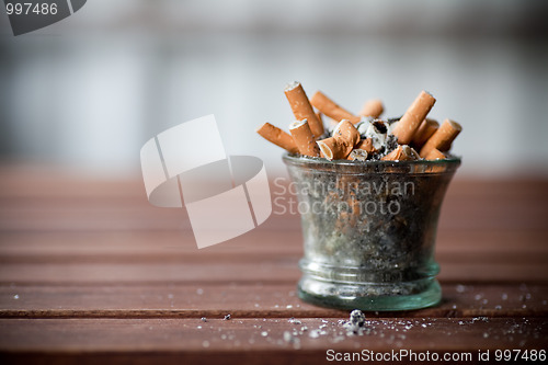 Image of ashtray full with butts