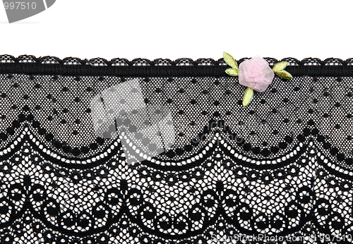 Image of Black lace with rose satin flower on white background
