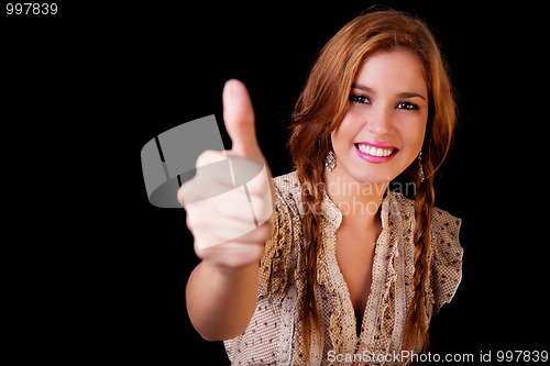 Image of Young pretty women with thumb raised as a sign of success, thumbs up