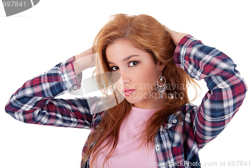 Image of beautiful young woman, holding her hair with his hand