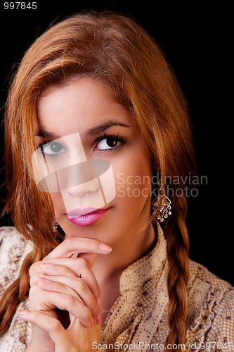 Image of Young pretty women with braids,thinking