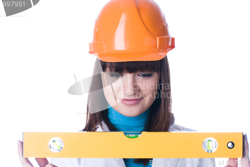 Image of Woman in helmet with level