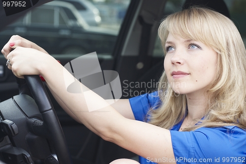 Image of Young woman in a car