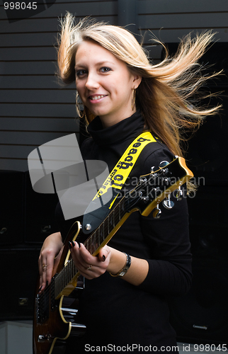 Image of Woman with guitar