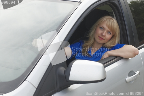 Image of Young woman in car