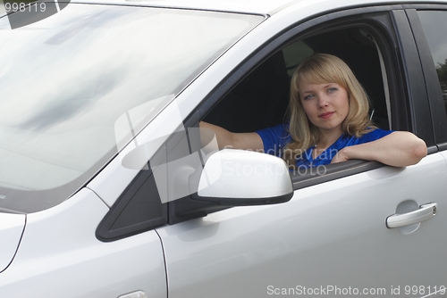 Image of Young woman in car