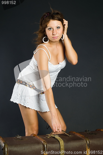 Image of Beautiful girl with suitcase