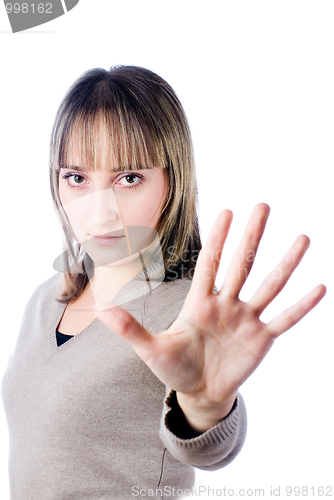 Image of Young woman showing "stop!"