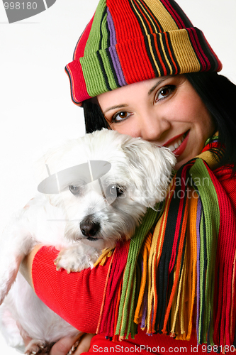 Image of Beautiful woman holding a pet dog