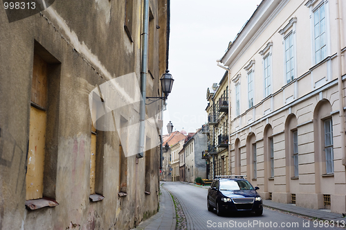 Image of Modern car in narrow paved street