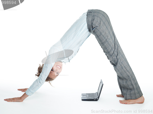 Image of Flexible businesswoman with laptop