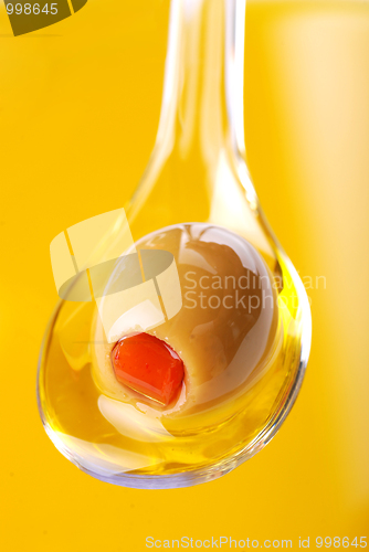 Image of A spoon with an olive 