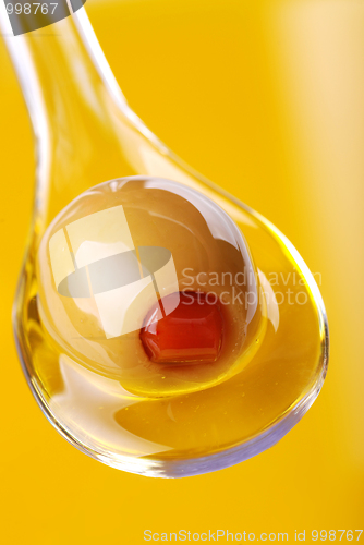 Image of A spoon with an olive 