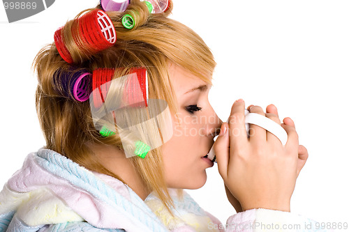 Image of housewife with curlers and cup