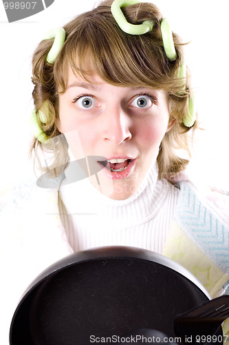 Image of crazy housewife with pan