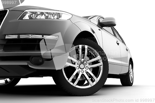 Image of Car front bumper, light and wheel on white