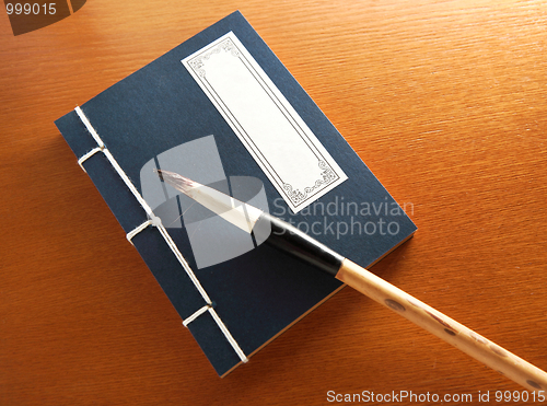 Image of chinese book and writing brush