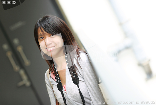 Image of asian woman in casual wear in city