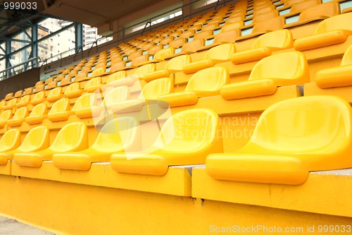 Image of Yellow chairs inside the stadium