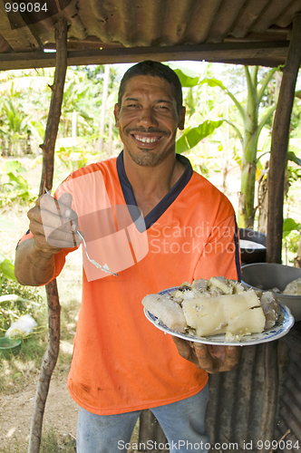 Image of native Nicaragua man freshly cooked seafood rondon rundown food 