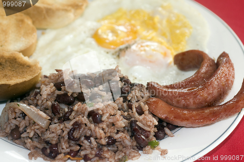 Image of breakfast in Nicaragua gallo pinto eggs sausage