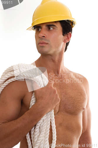 Image of Builder carrying rope closeup