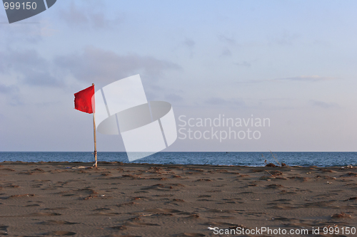 Image of red flag on beach