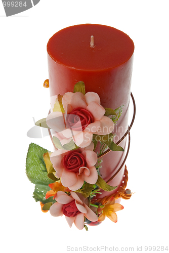 Image of Large red candle with the flower decoration