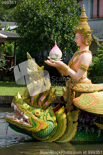 Image of Barge decorated with religious symbols in Thailand