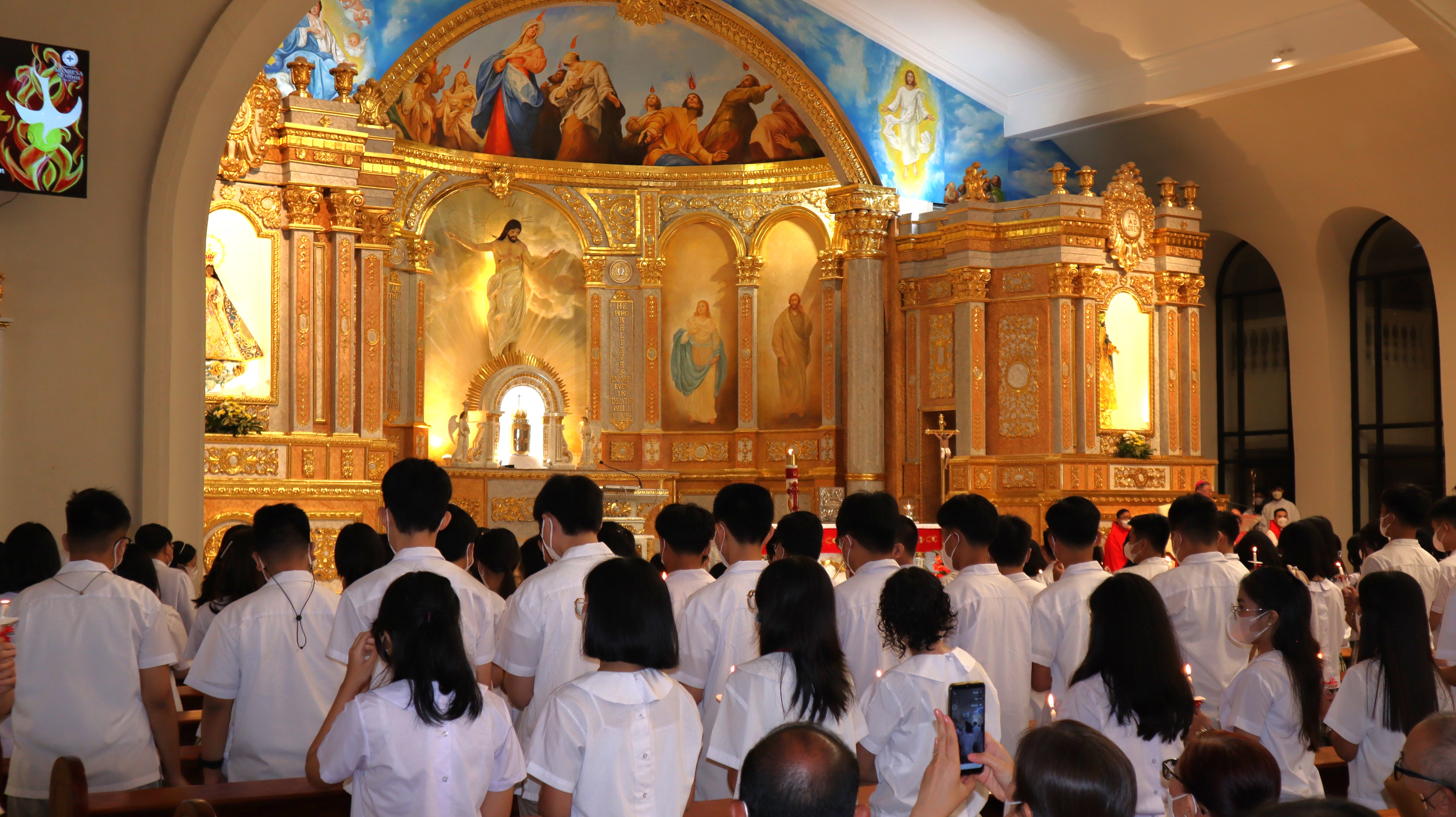 Bishop Mercado administers the Sacrament of Confirmation