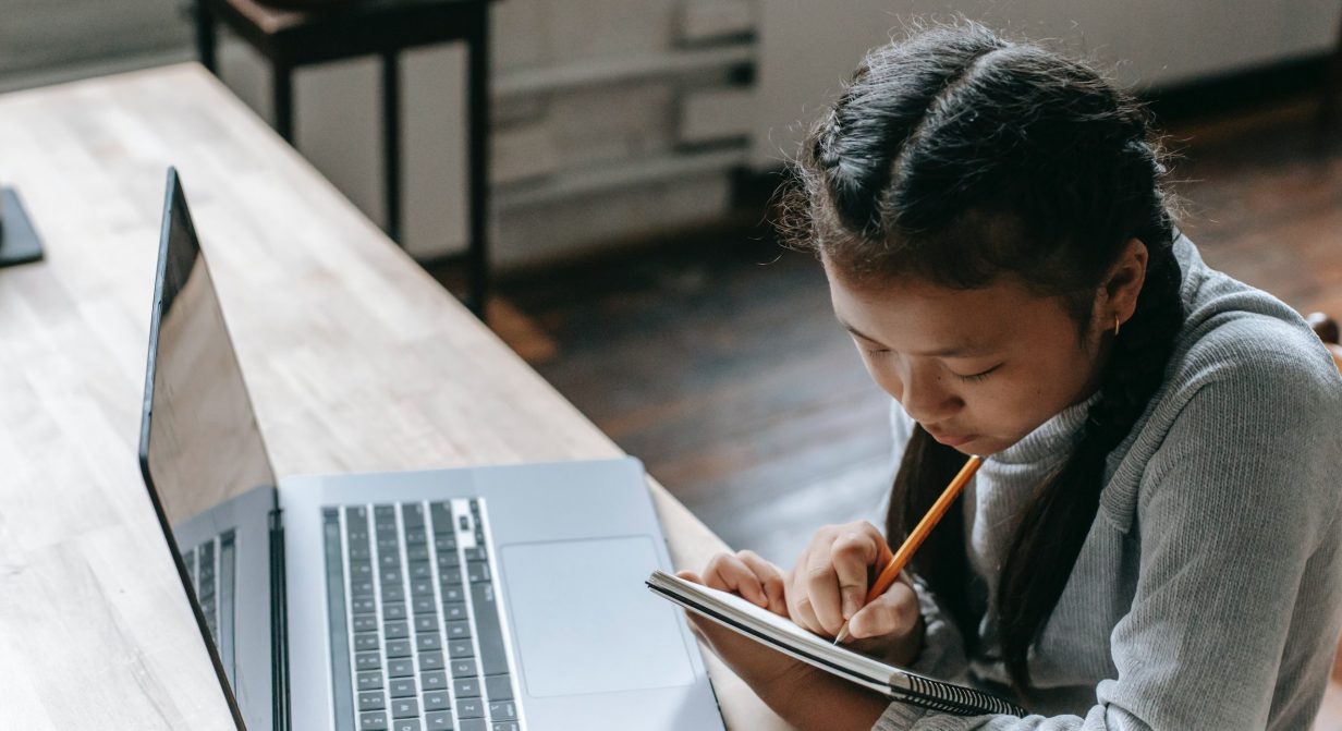 student working on missing assignment at home
