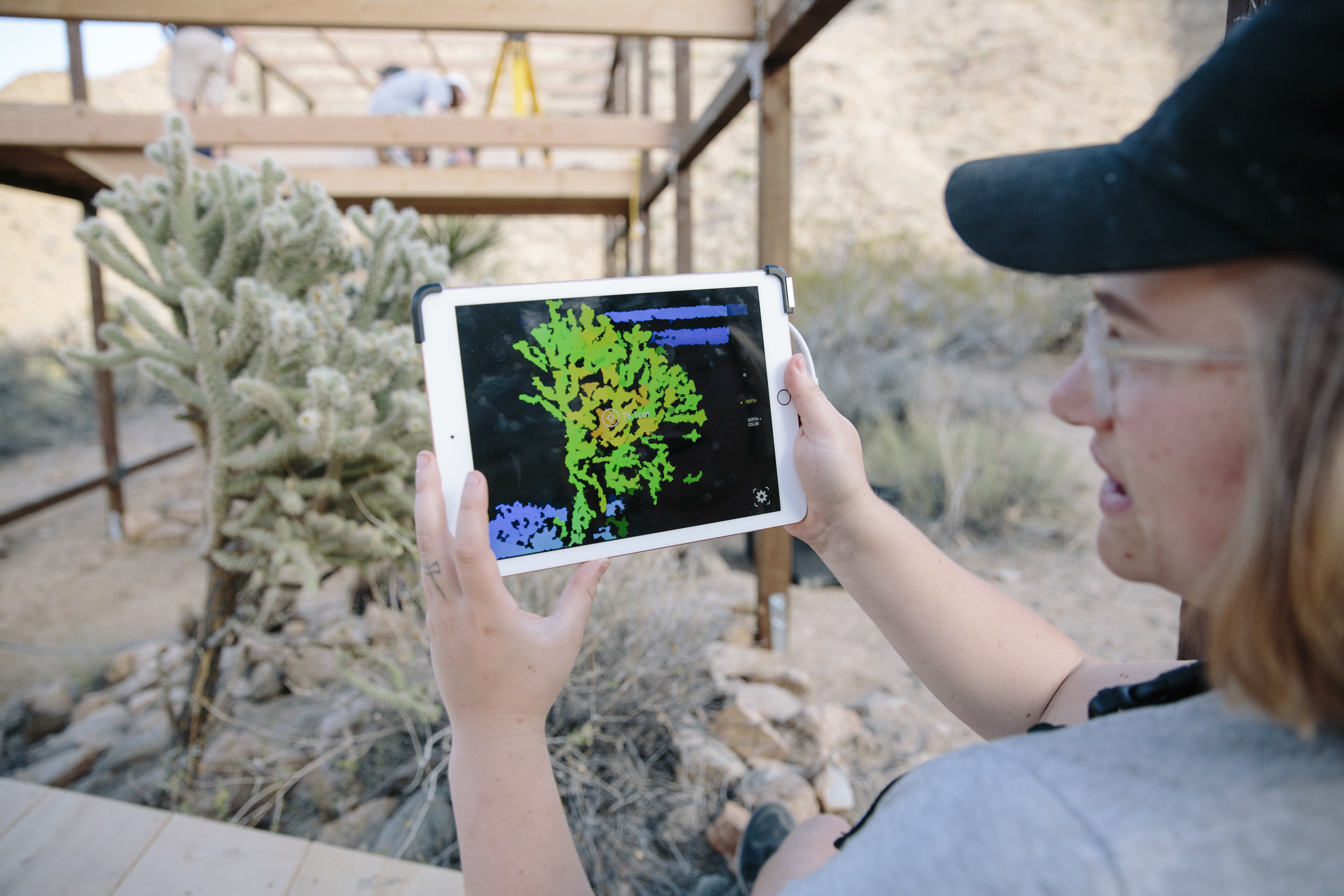 student using AR technology to represent plant realtimet ipad