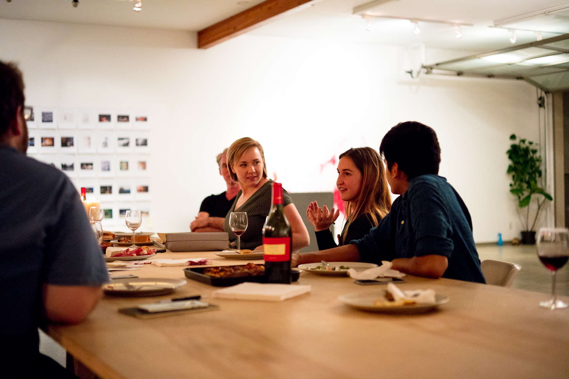 students discussing at dinner table enthusiastically