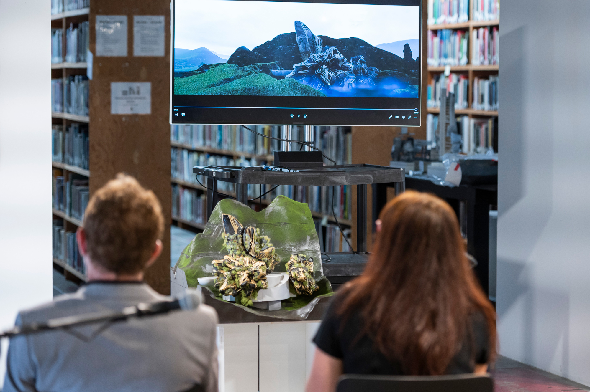 people sitting in front of student project