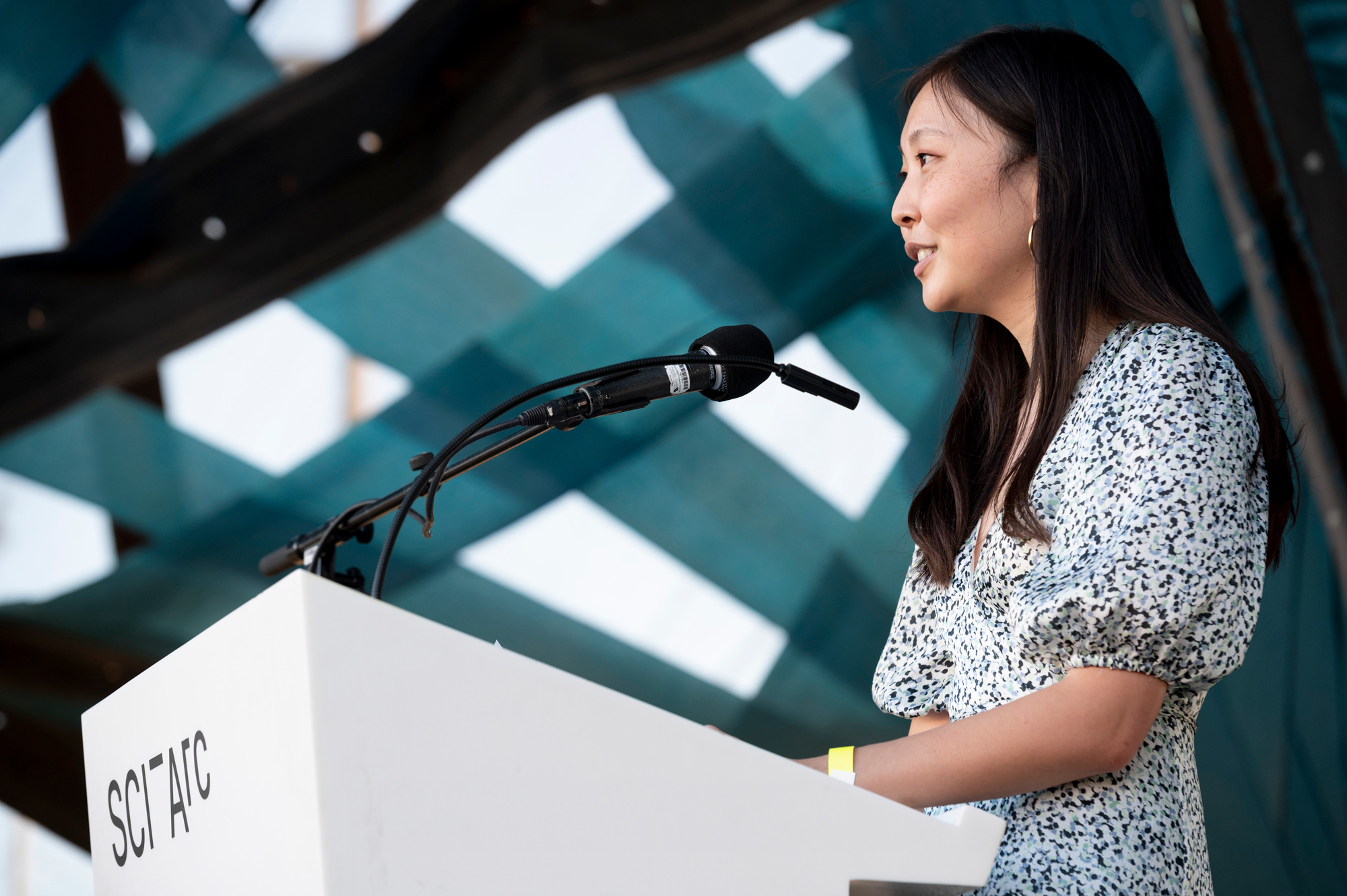 woman podium speaking mic