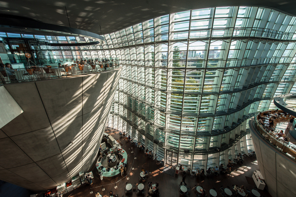 curved glass facade building interior mezzanine shot