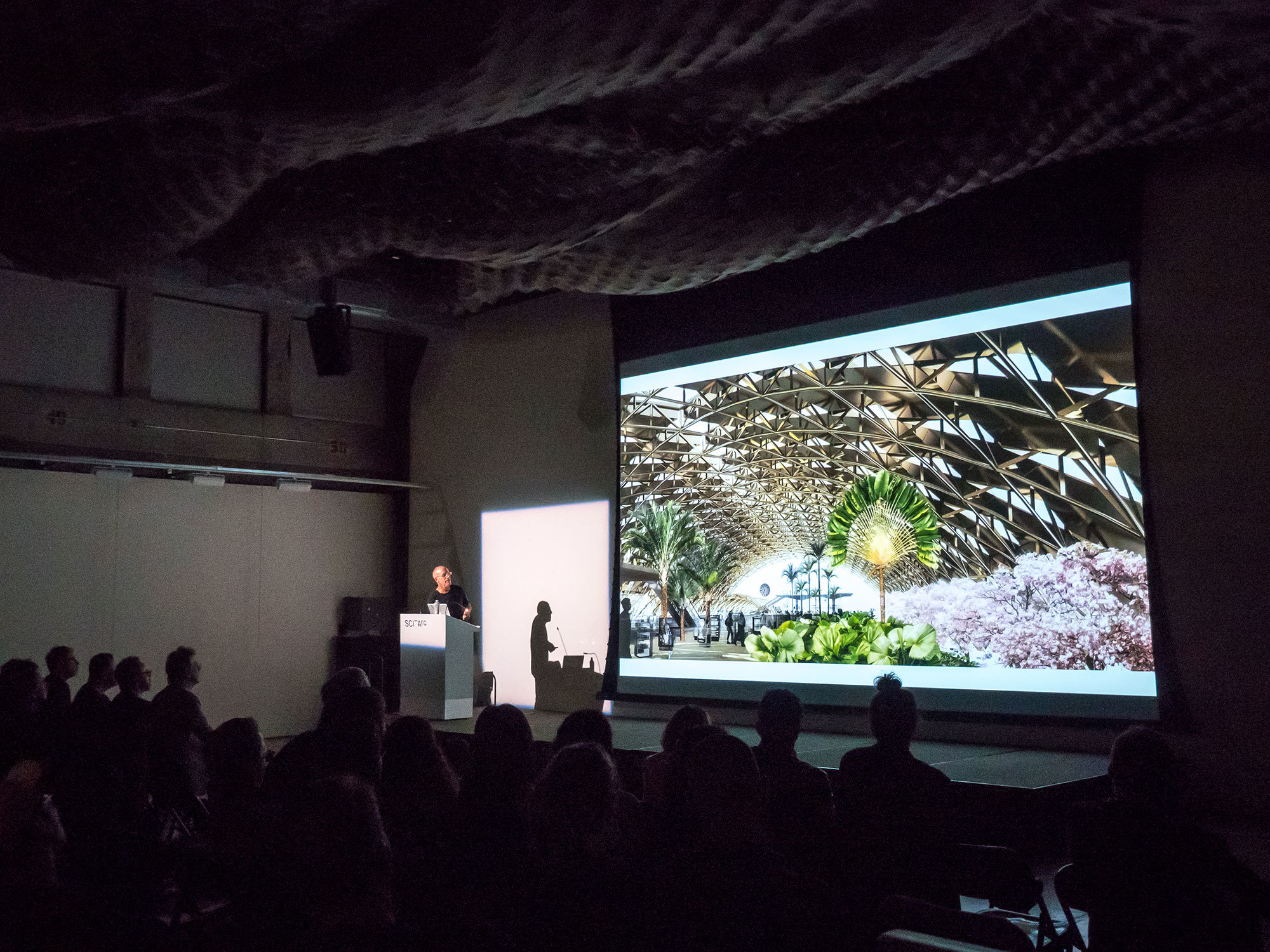 a lecturer presenting in front of sci-arc students and faculties