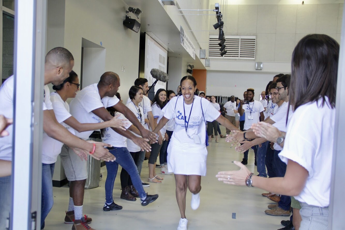 a happy lady clapping hands with others