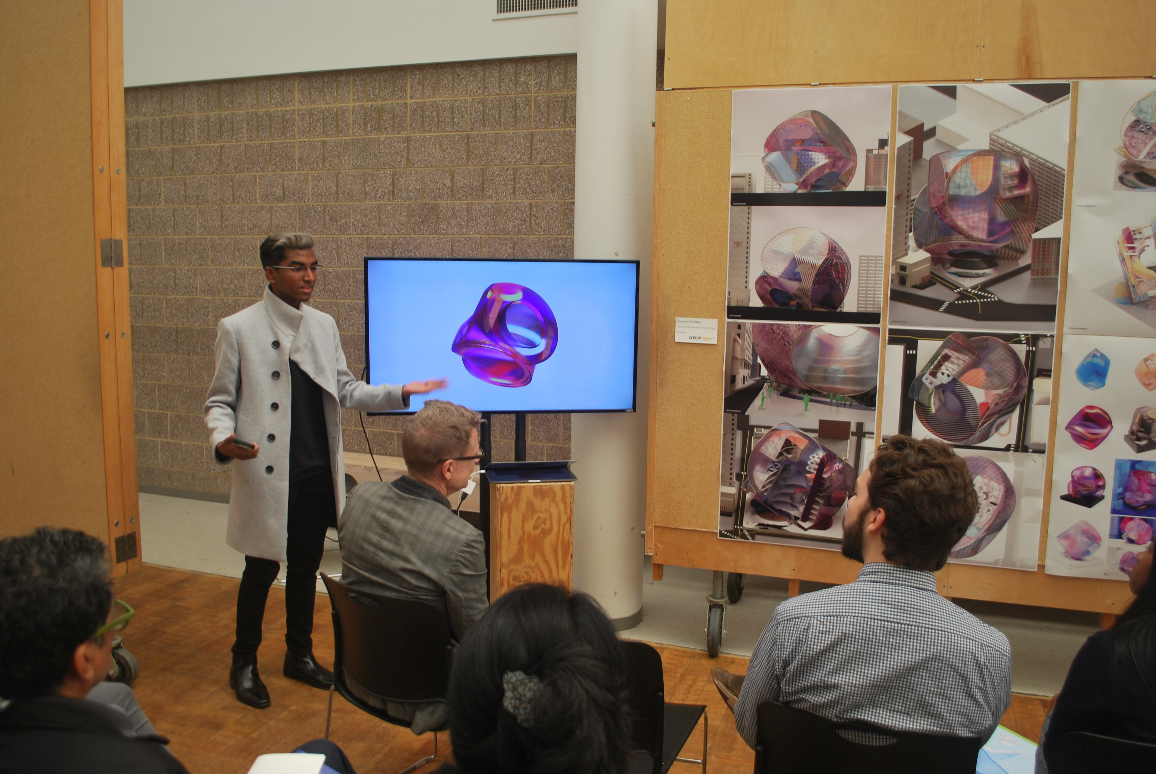 a student presenting his project in front of Architectural Enthusiasts