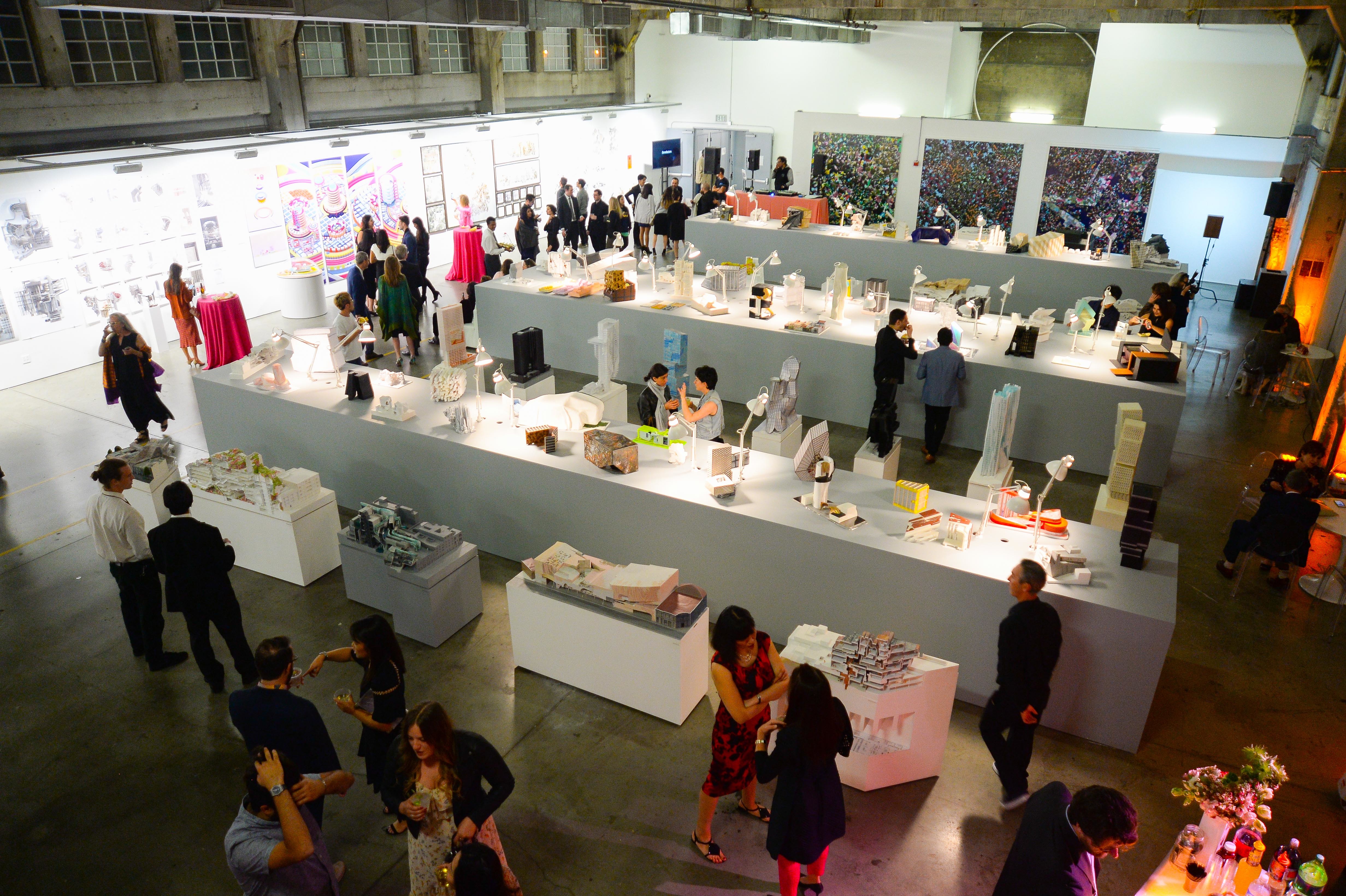 people admiring the architectural model displayed in school