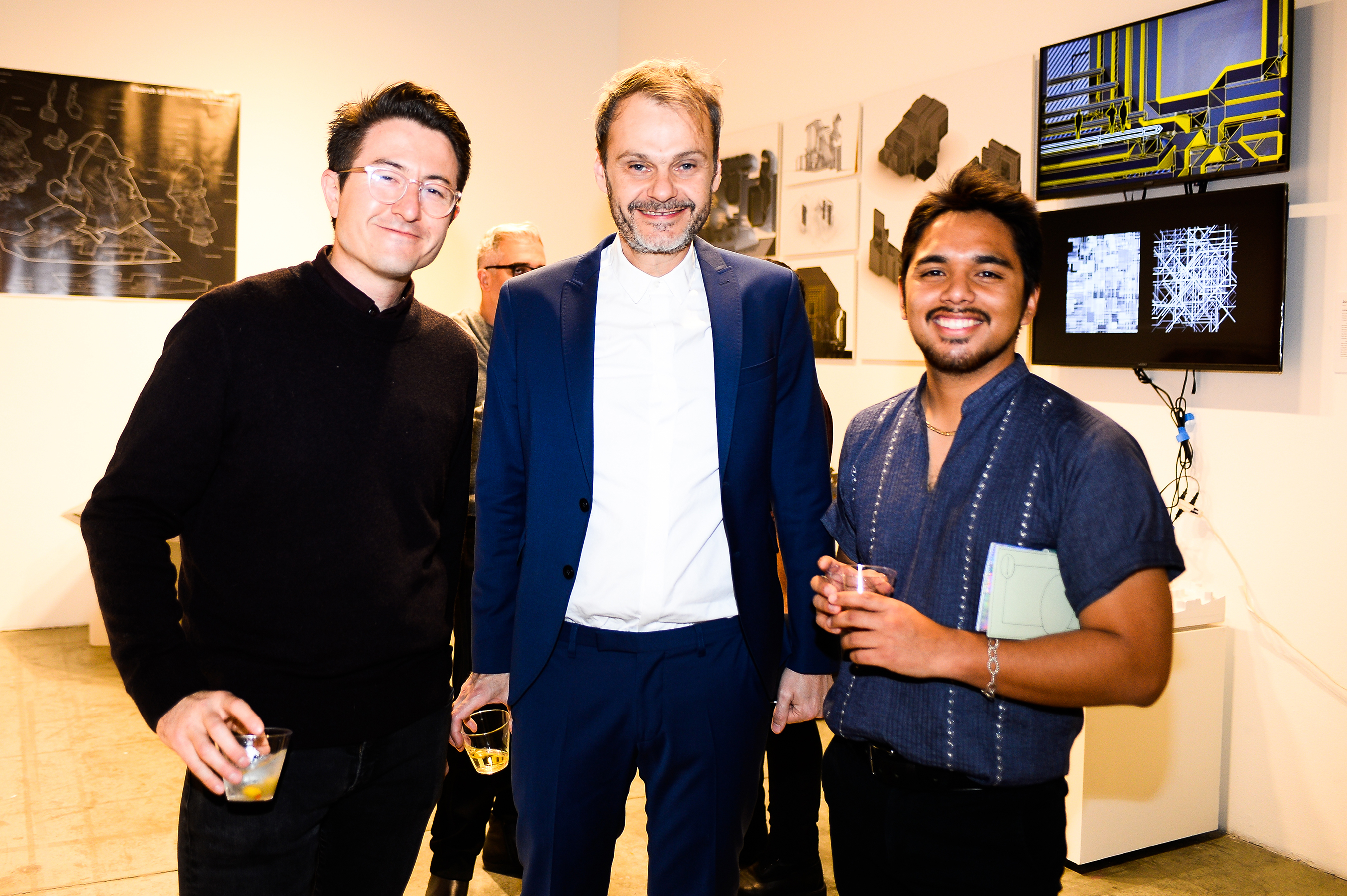 Three men posing for a picture together