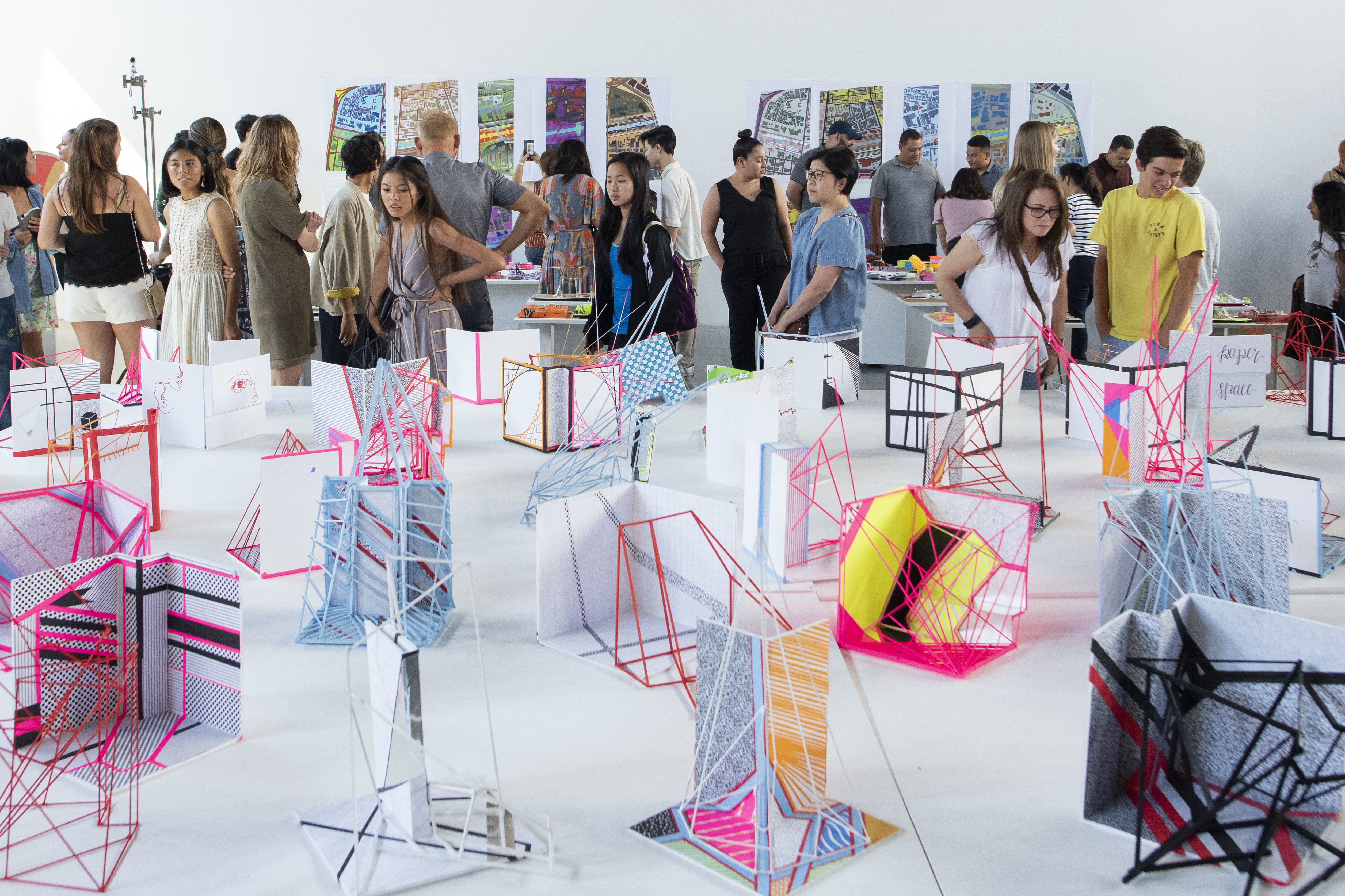 Architectural Enthusiasts admiring an architectural model from DID program