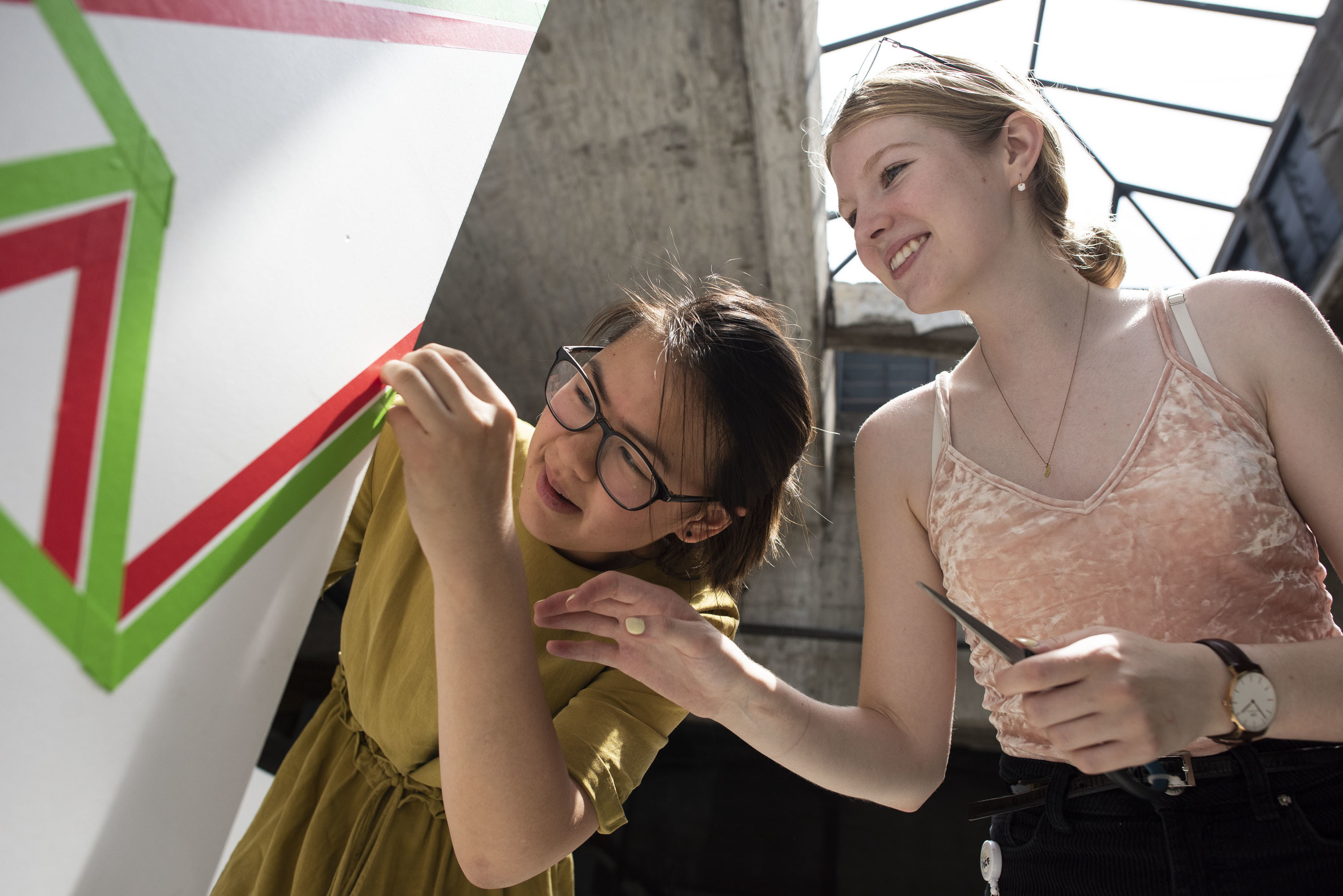 two girls working on an architectural model