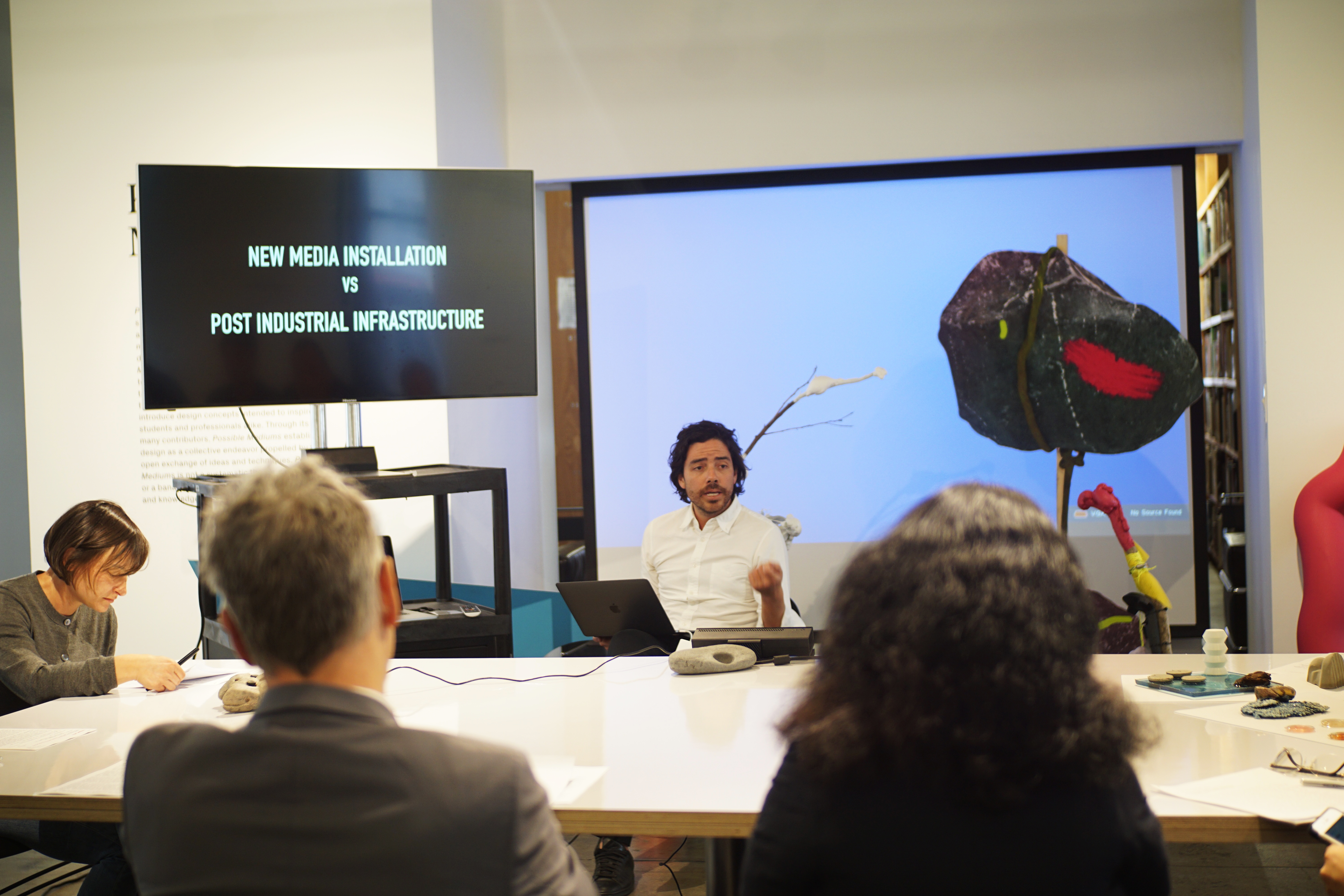 A sciarc student presenting his project to SCI-Arc faculties