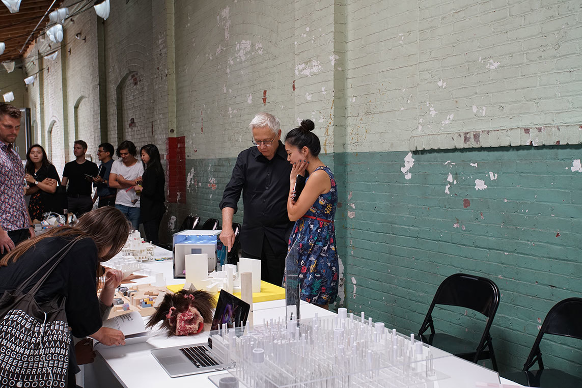 Architectural Enthusiasts admiring miniature models