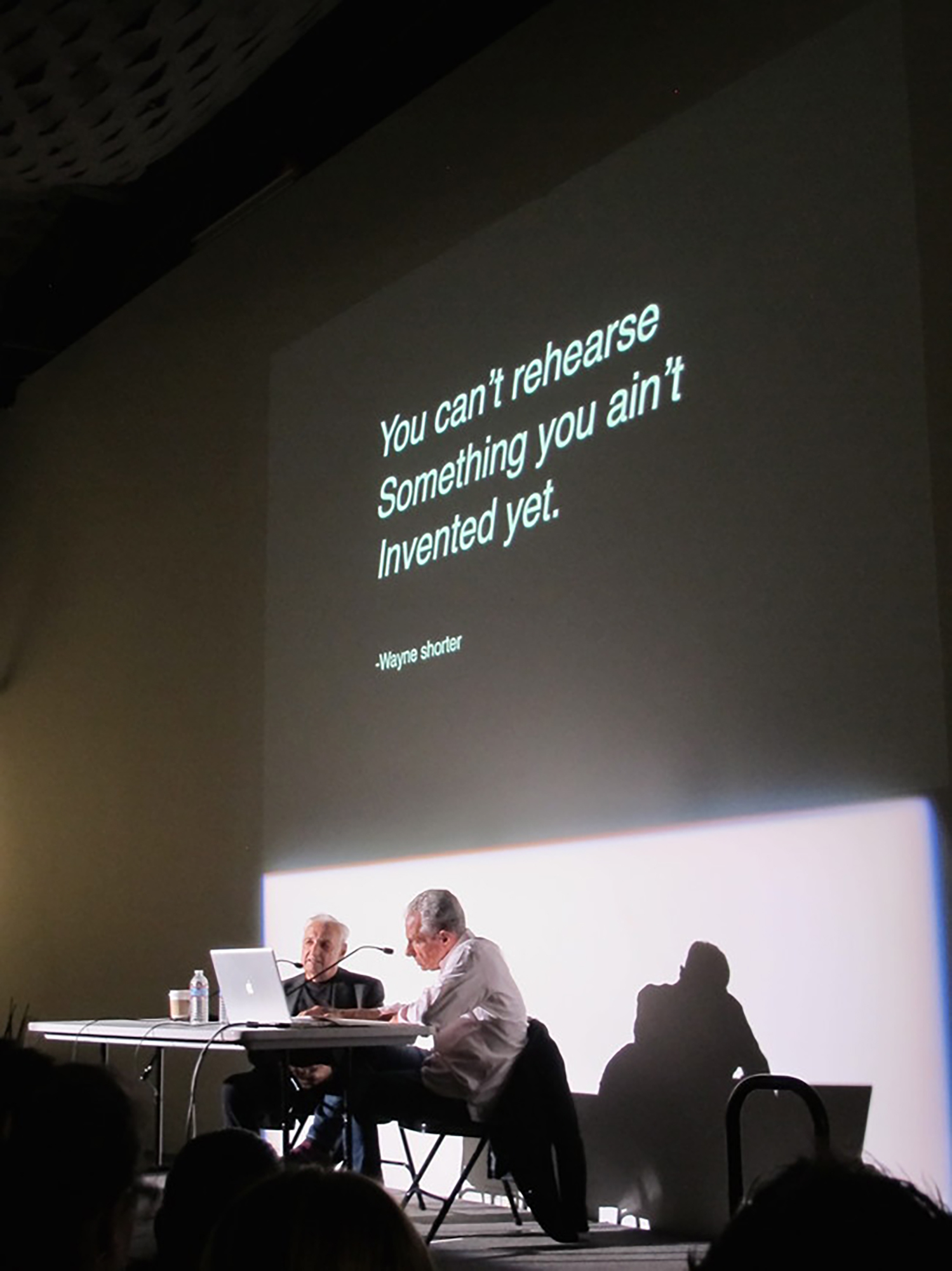 Architect Frank Gehry discussing with a Faculty member