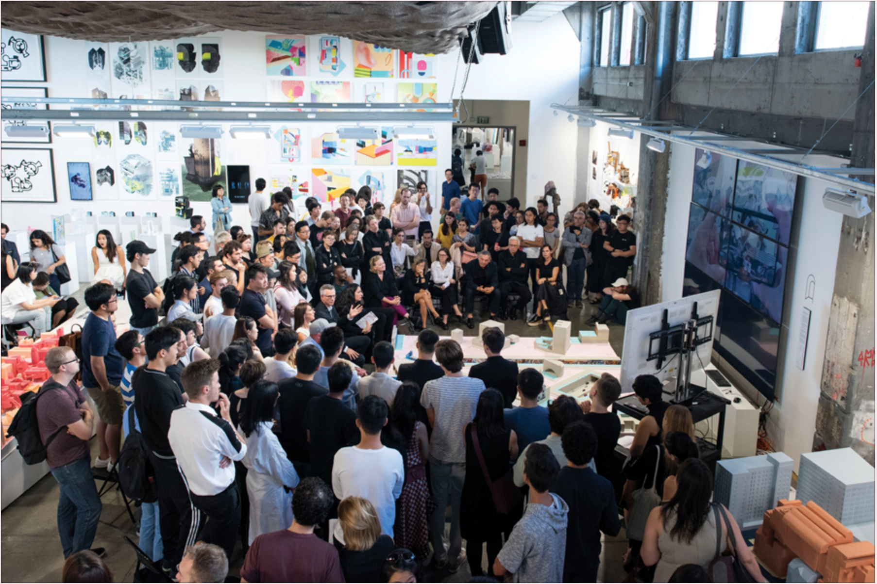 A huge group of architectural Enthusiast admiring a thesis presentation