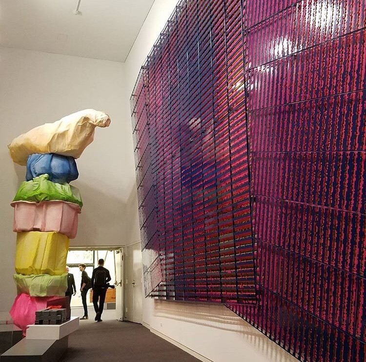 a pink and purple colored facade skin model exhibited in gallery